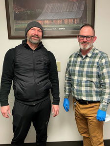 Two men standing together.